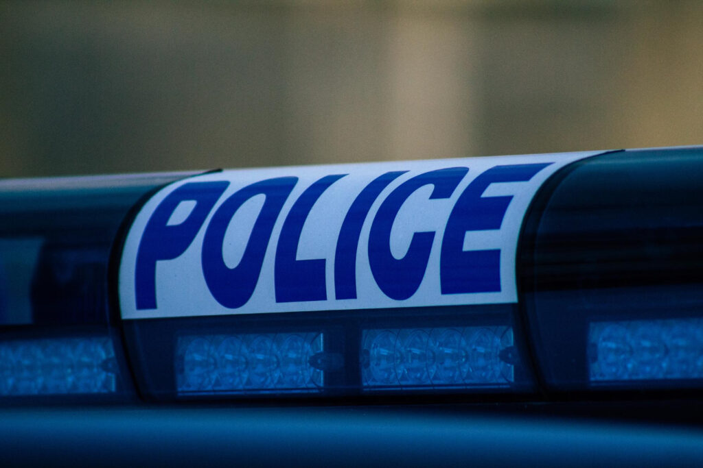 police sign on police vehicle